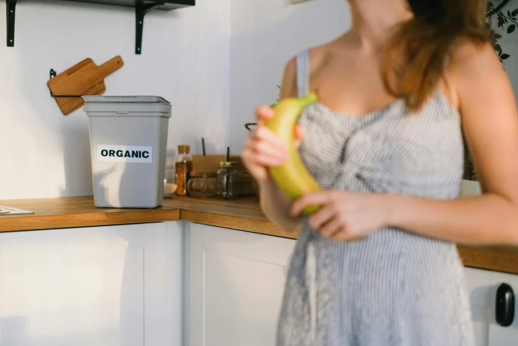 Photo by SHVETS production: https://www.pexels.com/photo/crop-woman-with-organic-banana-in-hands-standing-in-kitchen-7513225/